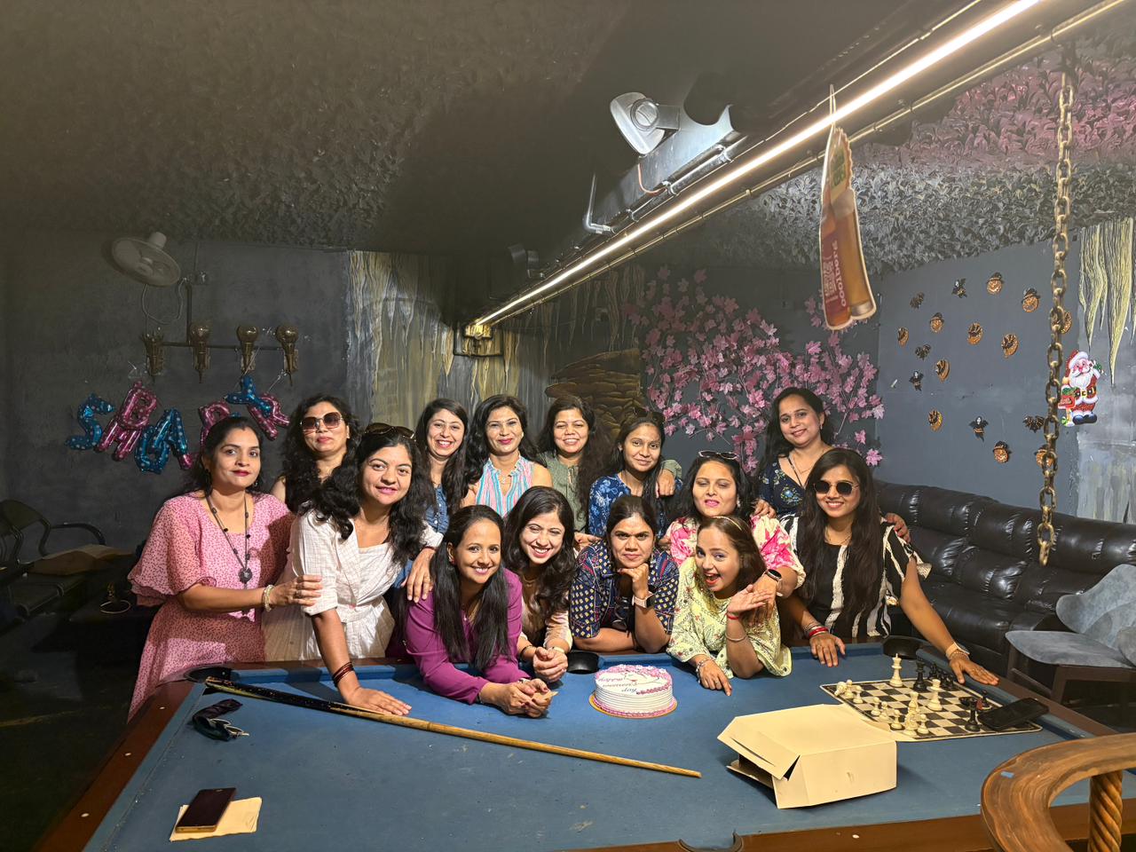 Friends celebrating at The Cave Cafe